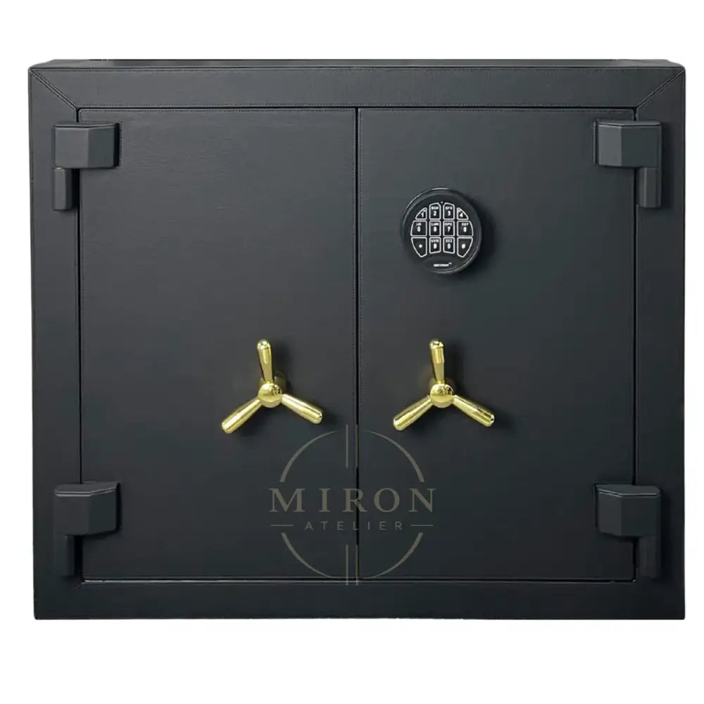 Black safe with gold handles on a white background