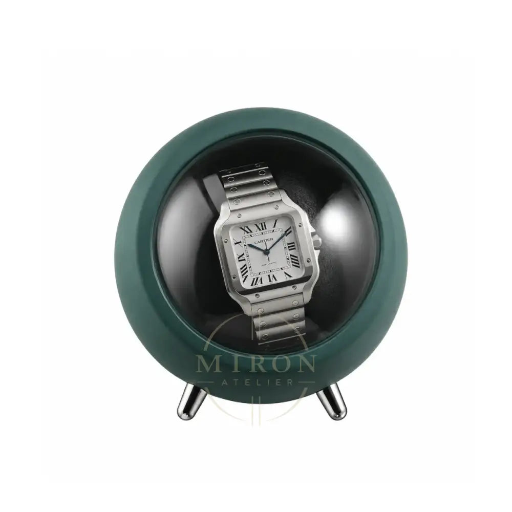 Silver Cartier Santos watch in a green watch winder