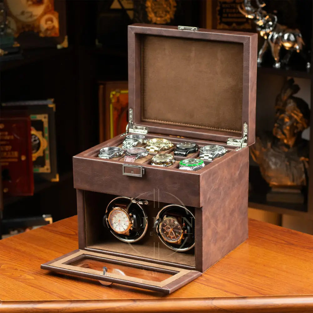 Wooden watch box with two watches inside on a wooden surface.