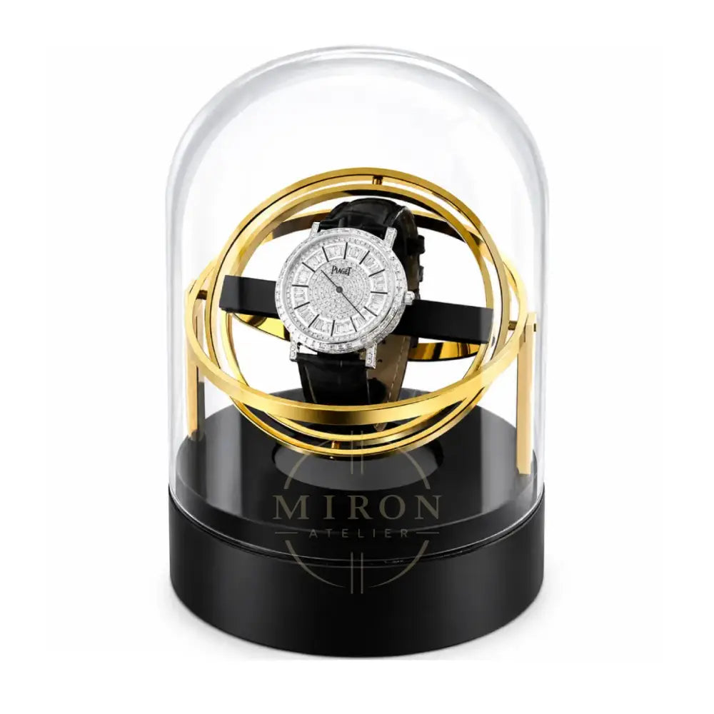 Luxury Watch under a glass dome with gold accents on a black base of a gyro watch winder