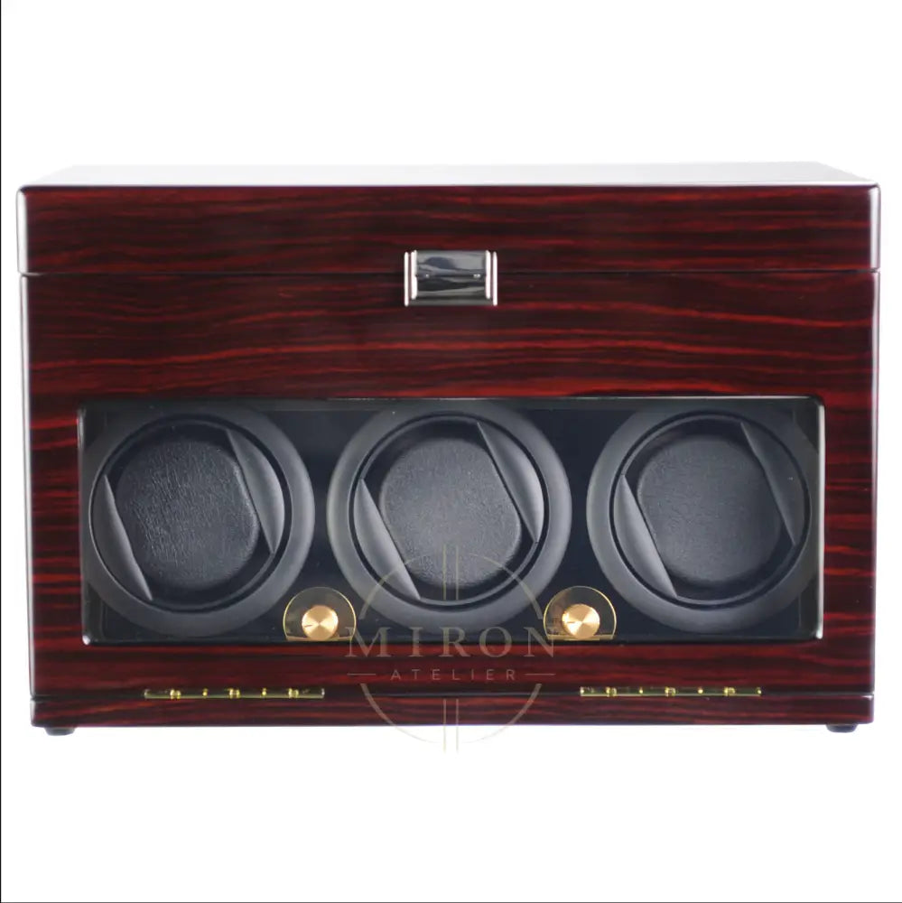Wooden watch winder with three compartments on a white background