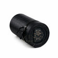 Black crocodile-patterned watch winder on a white background