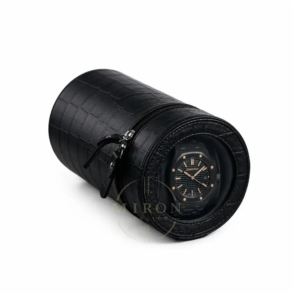 Black crocodile-patterned watch winder on a white background