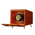 Wooden watch winder with a gold rolex watch inside on a white background